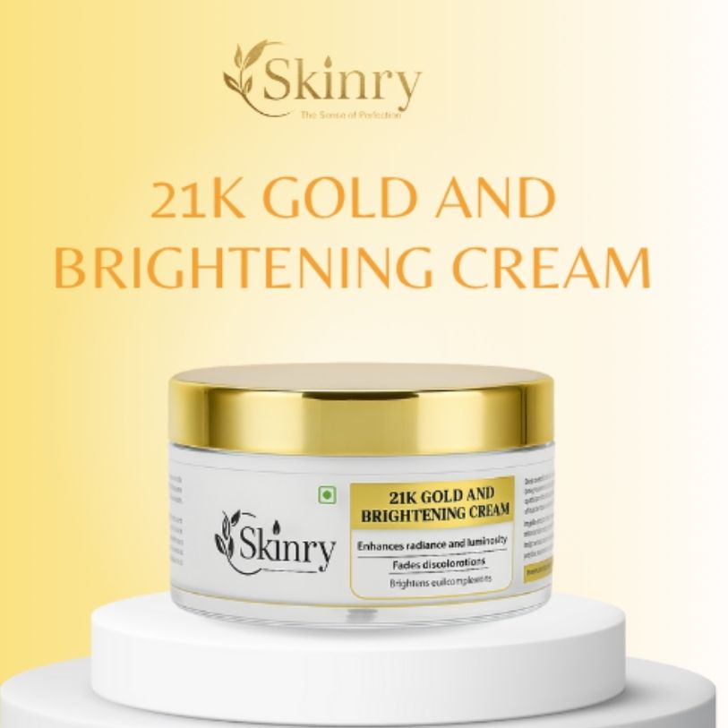 Skinry jar of 21K gold brightening cream in white pot with gold lid on pedestal yellow background