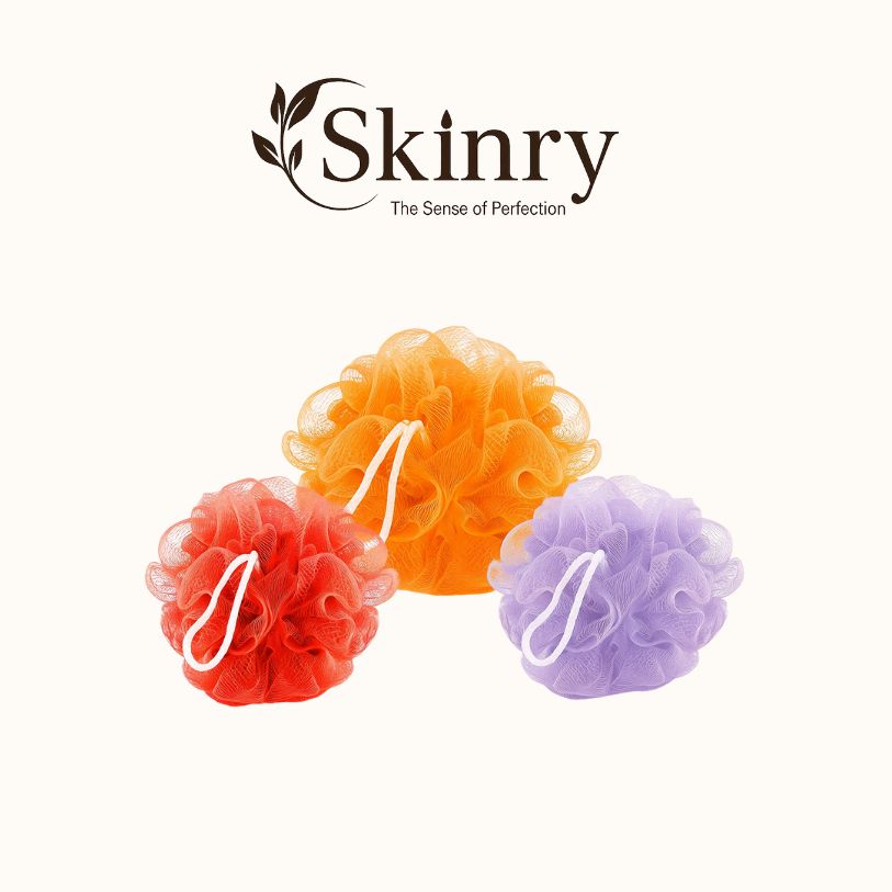 Set of three body scrubber loofah mesh bath poufs in orange red and purple with hanging loops for gentle exfoliation