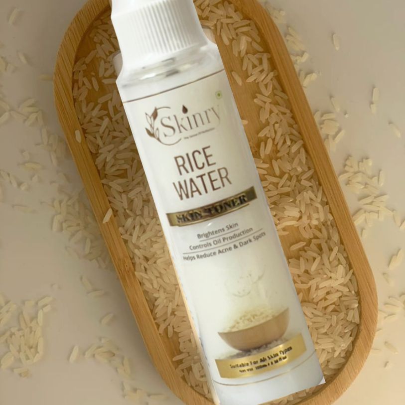 My Store rice water toner for face bottle on rice grains in wooden tray showing product label and texture benefits