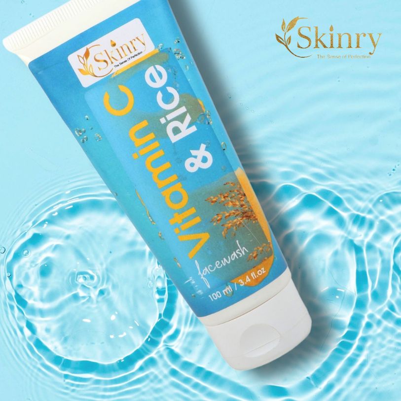 Skinry blue tube of Vitamin C and Rice face wash on water background vitamin c face wash for glowing skin