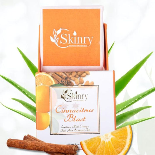 Skinry cinnamon citrus soap box with orange slice cinnamon sticks and aloe leaves in bright orange packaging