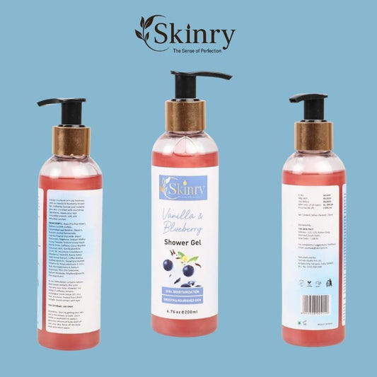 Skinry shower gel bottles trio on blue background vanilla and blueberry body wash with pump