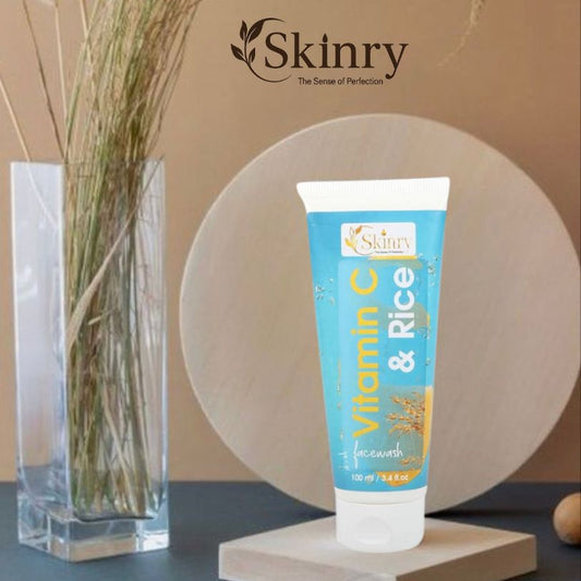 Skinry Vitamin C and Rice face wash tube on display with vase backdrop vitamin c face wash for glowing skin